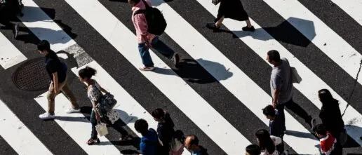People walking over zebra crossing ryoji-iwata-people-black-whi