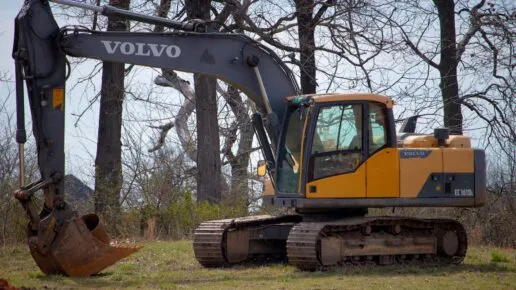 Photo by Jeremy Waterhouse: https://www.pexels.com/photo/yellow-and-black-excavator-on-green-field-near-leafless-trees-12063807/