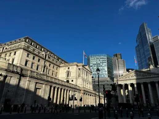 Old buildings in London against a blue sky