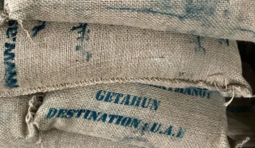 Stack of hessian bags containing coffee beans
